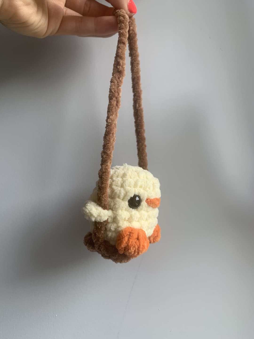 Image 2 de la variante Poussin balançoire