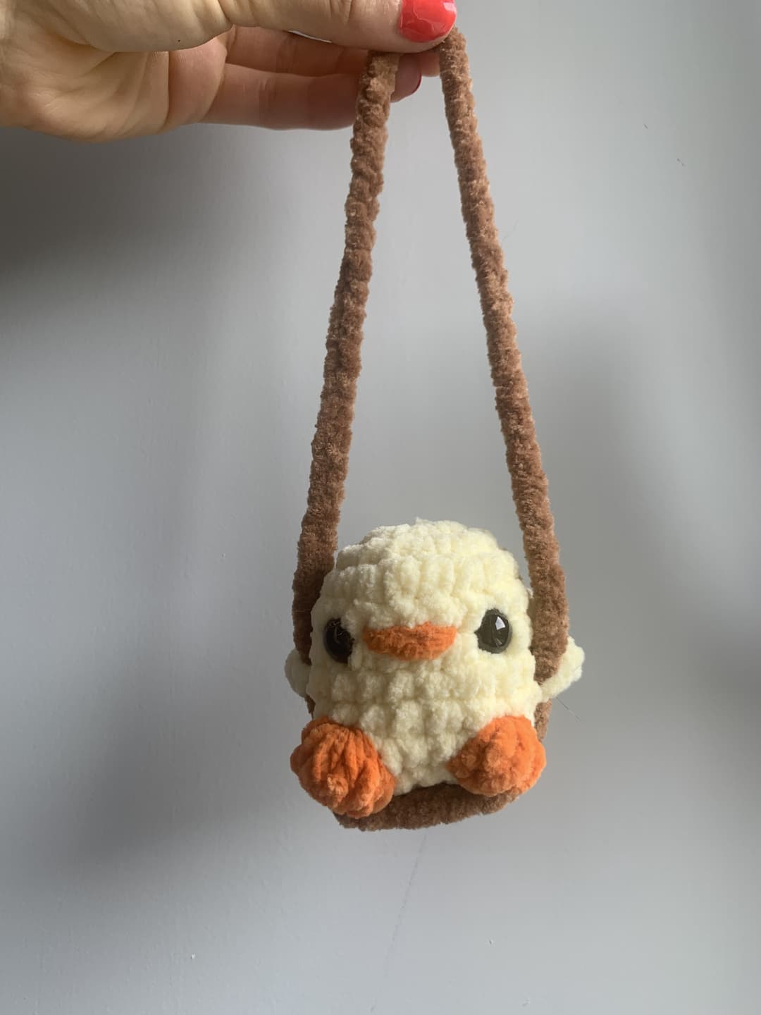 Image 1 de la variante Poussin balançoire